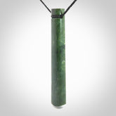 This photo shows a large jade drop shaped pendant. It a a lovely deep green Marsden jade. The cord is black and is adjustable in length. One only large, contemporary drop necklace from Jade, by Rueben Tipene.